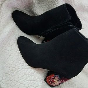 Black booties with design on heel